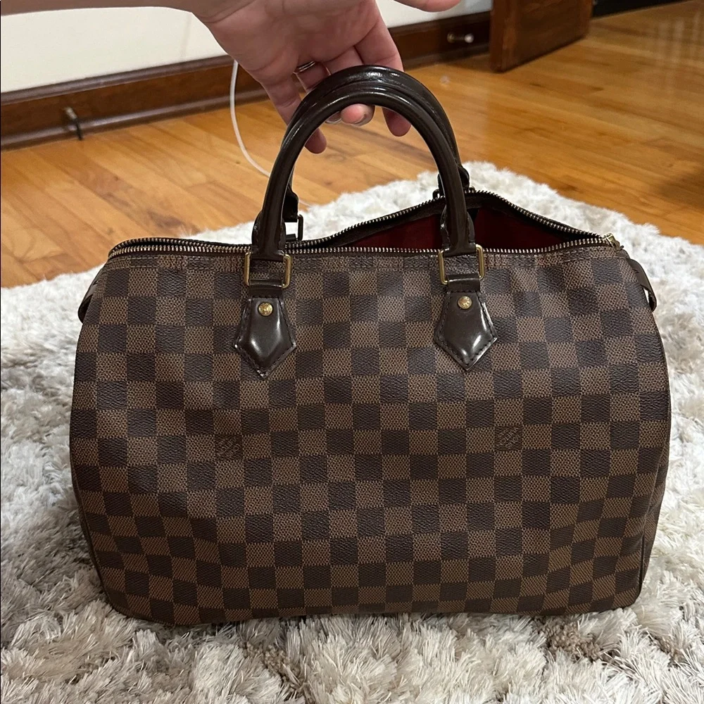 Louis Vuitton
Damier Ebene Speedy 35 - Picture 4 of 11